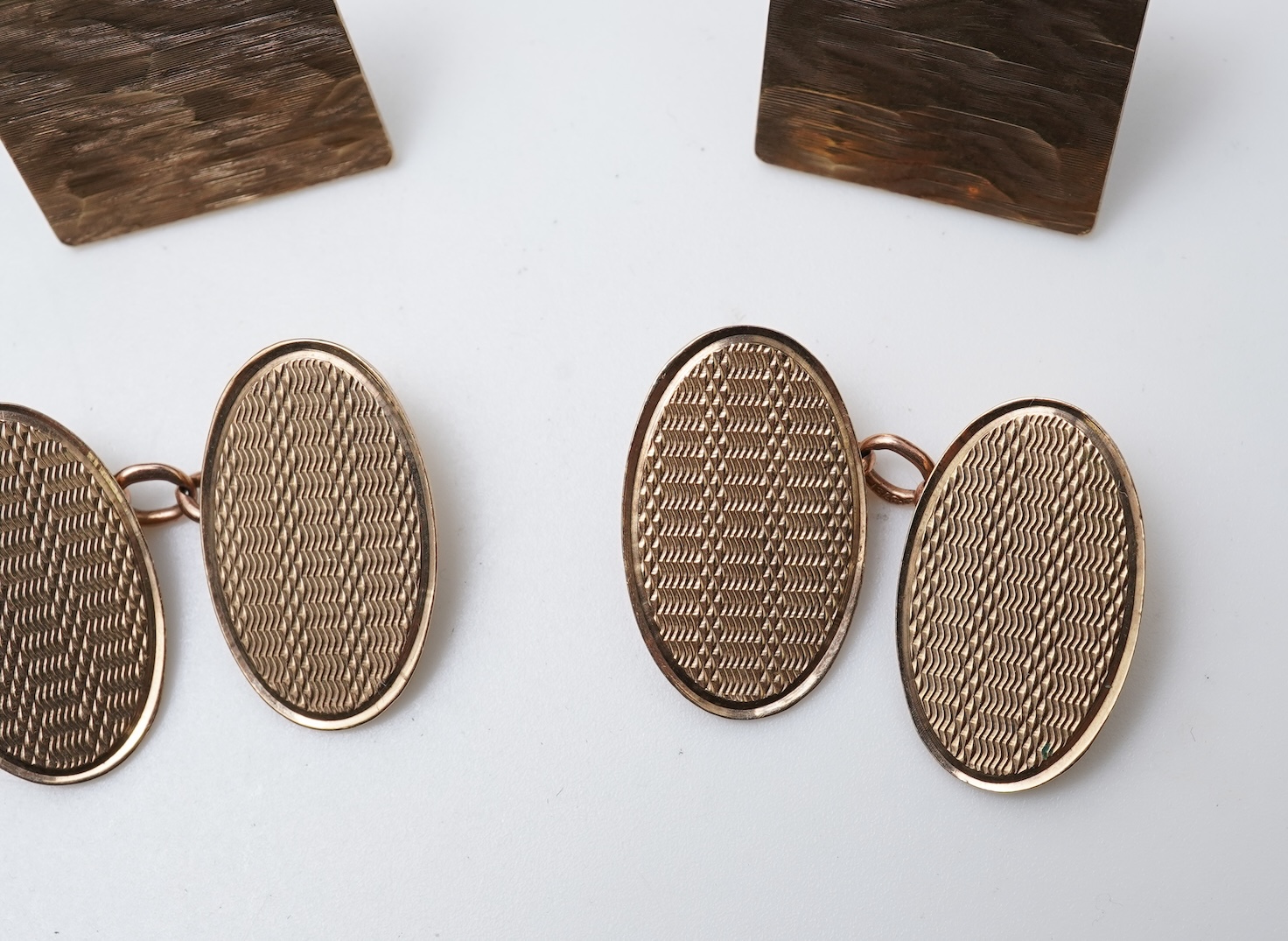 Two pairs of gold cufflinks